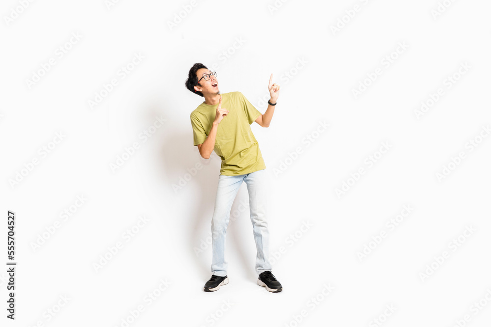 Single skinny young male. The full body of an Asian or Indonesian person. Isolated photo studio with white background.