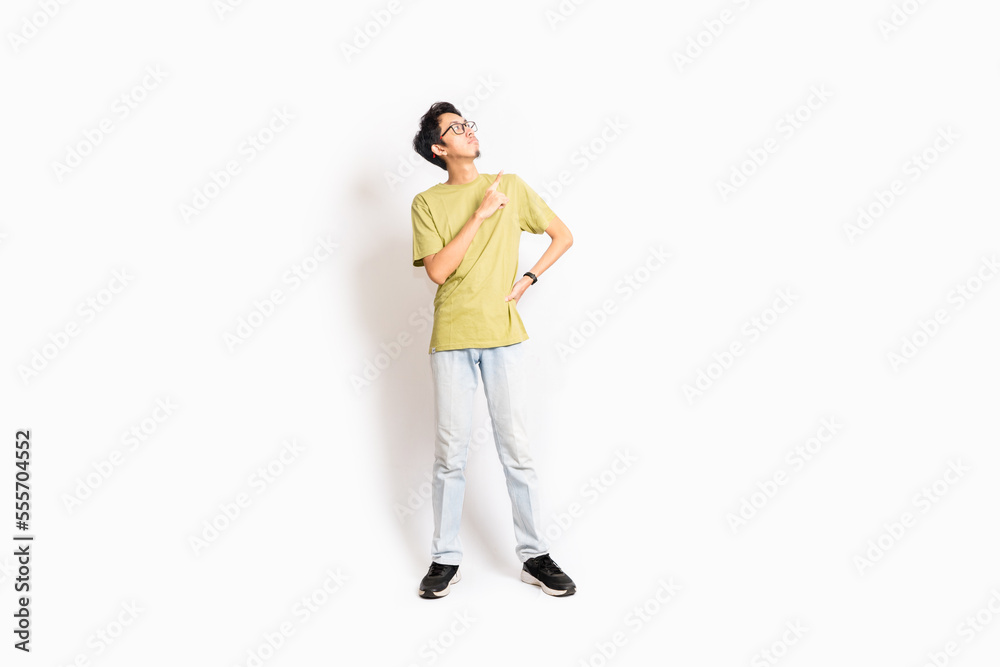 Single skinny young male. The full body of an Asian or Indonesian person. Isolated photo studio with white background. Single skinny young male. The full body of an Asian or Indonesian person. Isolated photo studio with white background.
