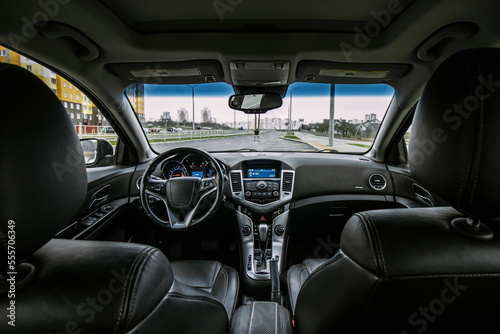 The interior of a car with a black leather interior and an automatic gearbox © Dzmitry Halavach