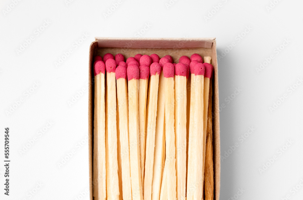 Matches macro. Open matchbox close-up on a white background. Matches macro. Open matchbox close-up on a white background.