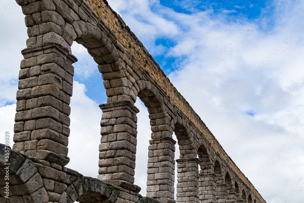 Segovia, España. April 28, 2022: Segovia aqueduct and blue sky.