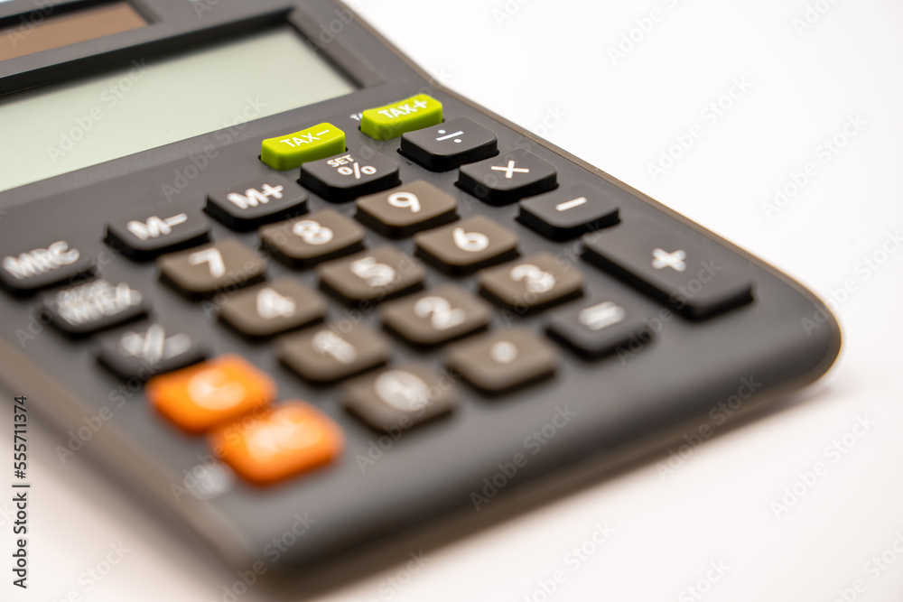 detailed close up of a black battery solar calculator key pad and lcd screen detailed close up of a black battery solar calculator key pad and lcd screen