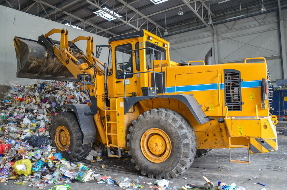 Wheel loader working in landfill. Wheel loader working in landfill.