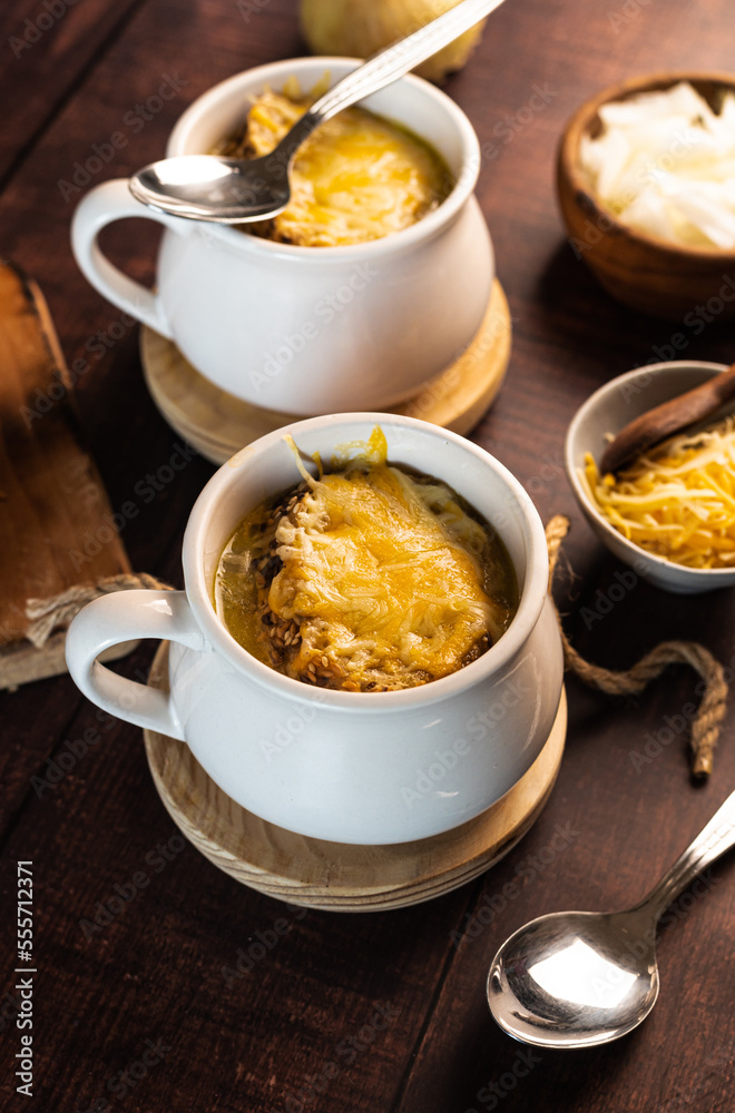 homemade onion soup on a wooden table homemade onion soup on a wooden table