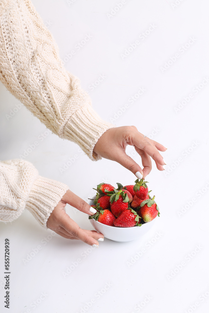 Girl holding bowl full of strawberries. Strawberry fruit bowl on white background. Girl holding bowl full of strawberries. Strawberry fruit bowl on white background.