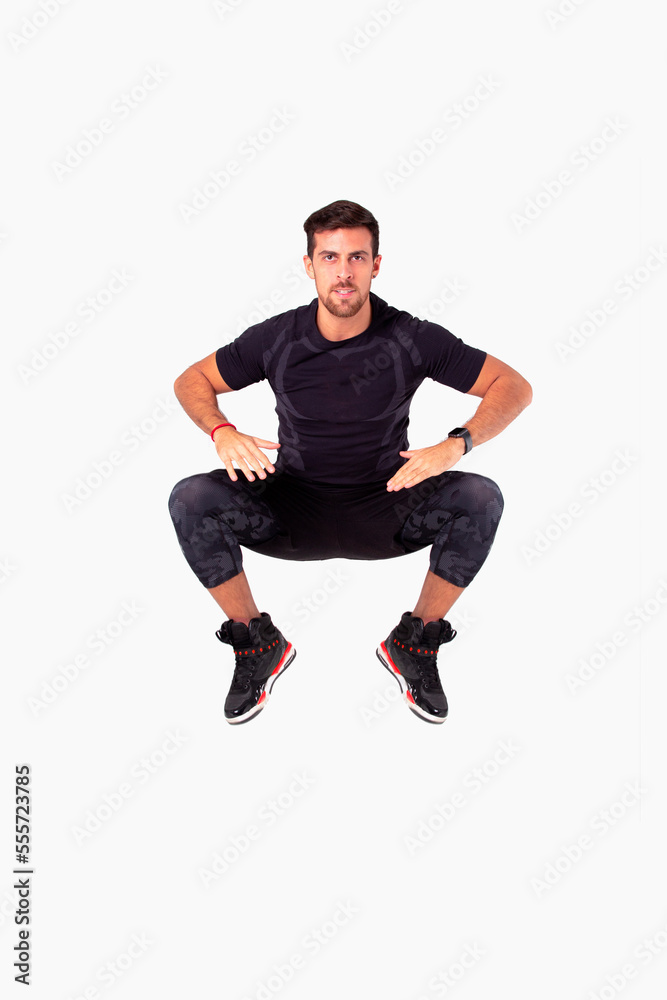 HIIT workout. Male fitness instructor working out. White background photoshoot.