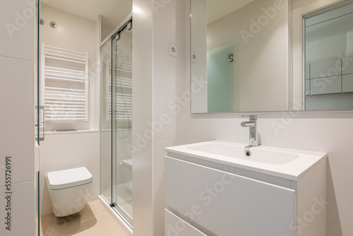 Bright room for taking morning and evening water procedures with frosted glass door. Sanitary ware made of high quality white porcelain. Shower cabin is separated from rest of space by glass railing.