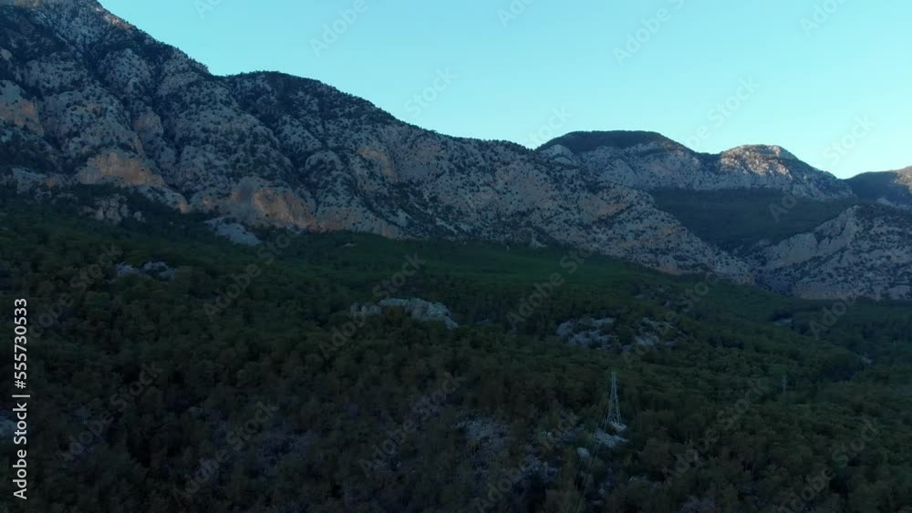 Power lines in the mountains. Laying of electrical networks in remote mountainous areas. Aerial view. High quality 4k footage Power lines in the mountains. Laying of electrical networks in remote mountainous areas. Aerial view. High quality 4k footage