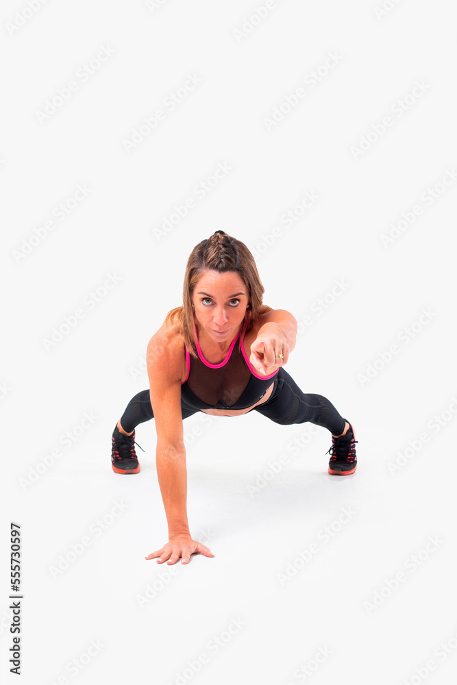 Mid age woman working out. Female fitness instructor exercising and working out HIIT. Strong woman working out. Fitness lifestyle. Mid age woman working out. Female fitness instructor exercising and working out HIIT. Strong woman working out. Fitness lifestyle.