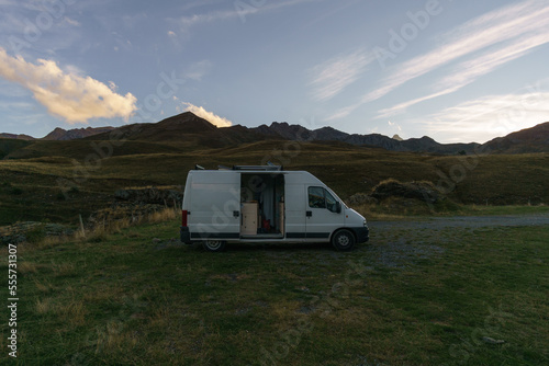 Camper Van in the Pyrenees Mountains at the french and spanish border during sunset, Frontera del Portalet, Huesca, Spain