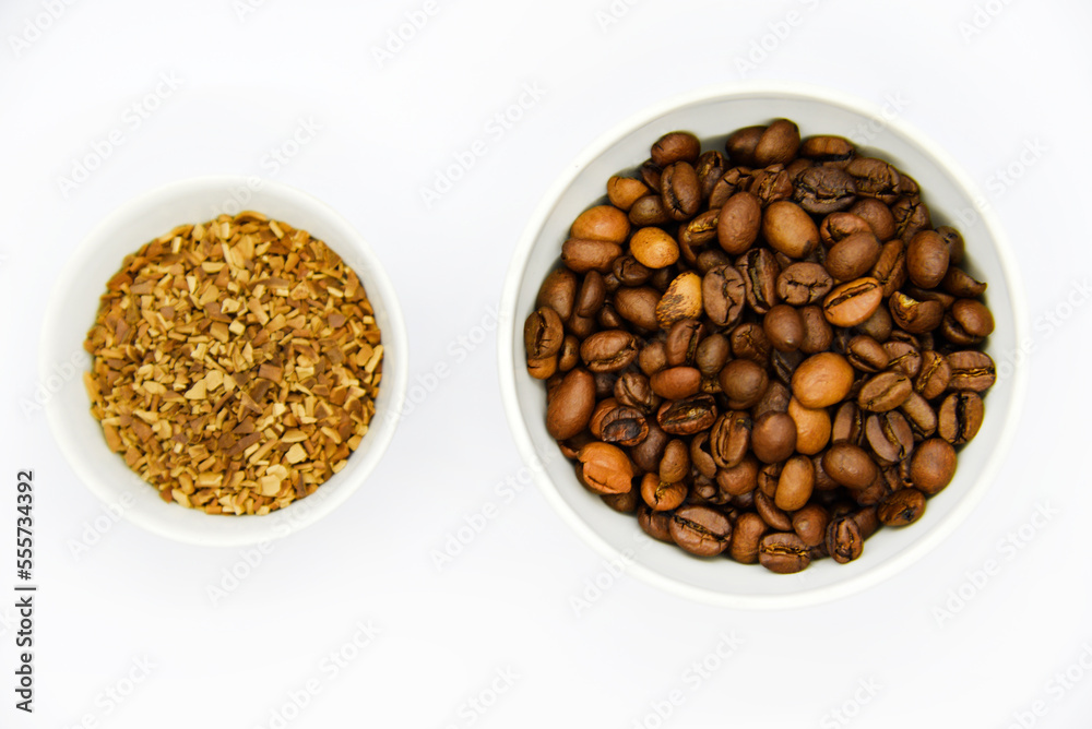 Fototapeta premium Toasted coffee beans in a porcelain cup. Coffee mixture. Delicious coffee beans and freeze-dried.