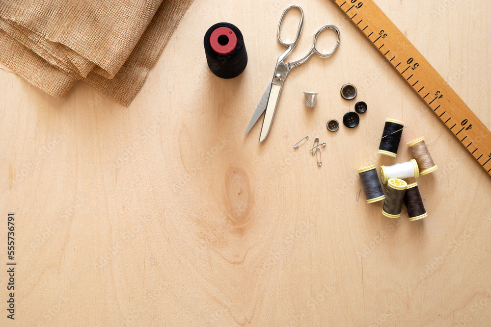 tailor cuts fabric with scissors tailor cuts fabric with scissors