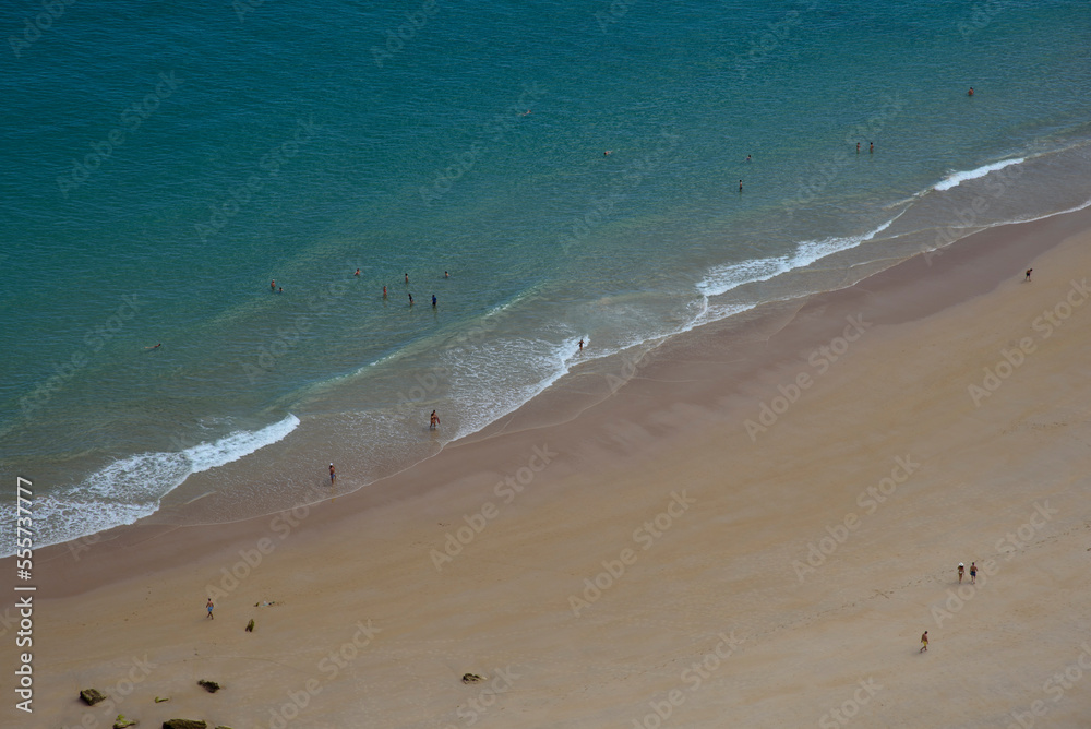aerial view of Ballota beach with people enjoying aerial view of Ballota beach with people enjoying