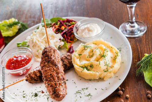 kebab with mashed potatoes closeup photo