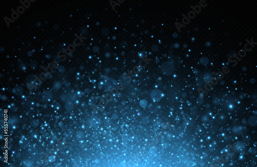 Glowing background of sparkles particles. Luminous background of sun flares. Blue sparks glitter special light effect. 