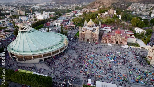 Aerial view of Basilica of Our Lady of Guadalupe. Virgin Mary's day pilgrimage. The old and the new Basilica. Basilica de Nuestra Señora Guadalupe, La Villa atrium. square. Mexico City. Drone shot