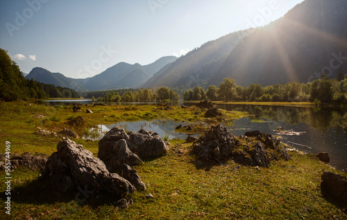 Diesige Sommer Stimmung am Lödensee im bayerischen Voralpenland bei Ruhpolding mit Blick vom Seeufer und Bergpanorama Landschaft im Hintergrund photo