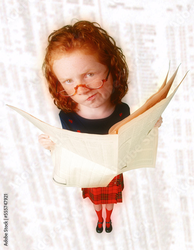 Portrait of Girl Reading Financial Page photo