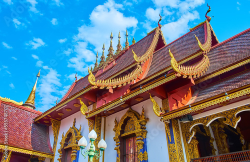Pyathat (multi-tired) roof of the Viharn in Wat Saen Muang Ma, Chiang Mai, Thailand photo