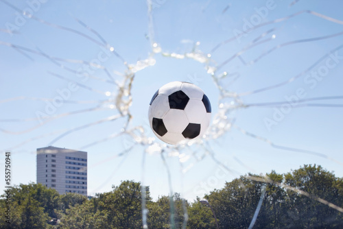 Soccer Ball Smashing through Window photo