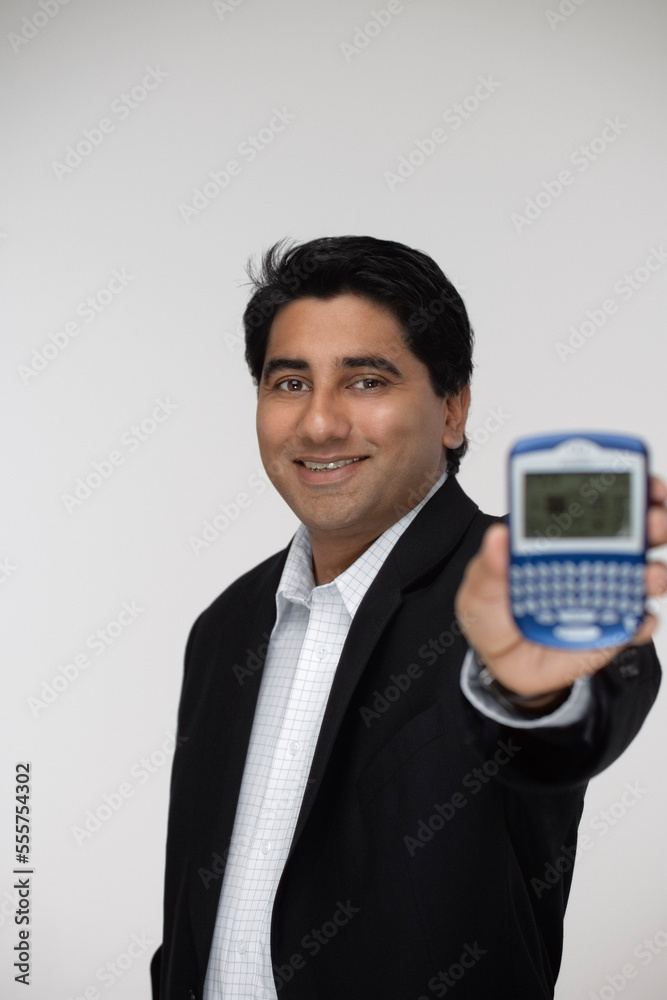 Portrait of Man Holding Personal Digital Assistant Portrait of Man Holding Personal Digital Assistant