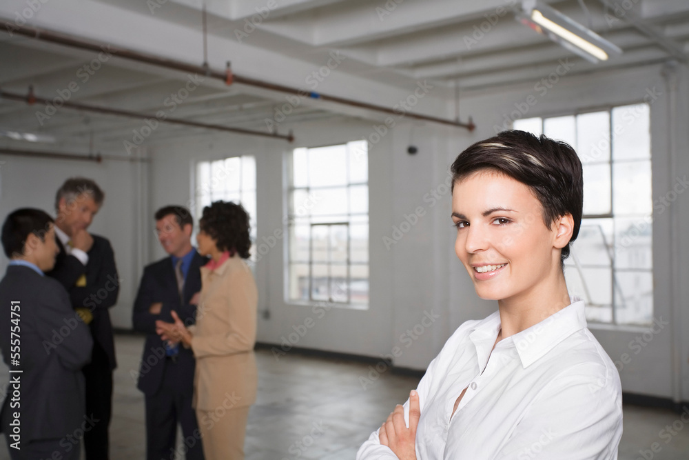 Portrait of Businesswoman with other Business People in Background
