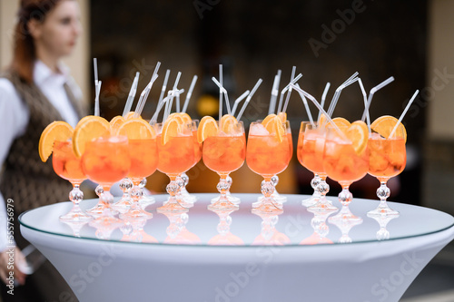 Obraz na plátně Front view of sets of alcohol cocktails, which prepared with ice and aperol in w