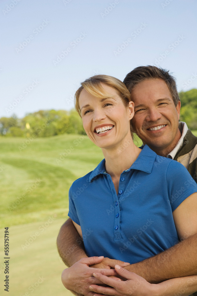 Portrait of Couple on Golf Course Portrait of Couple on Golf Course