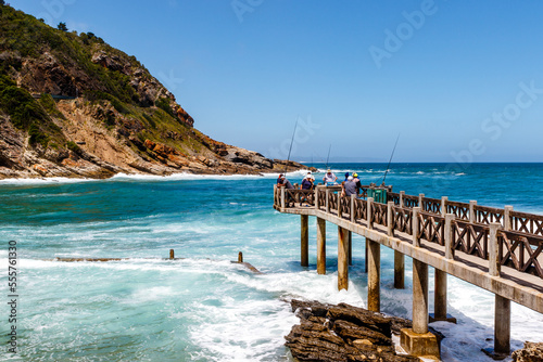 Fisher men are fishing in the ocean at Victoria Bay  Victoriabaai  South Africa  Africa