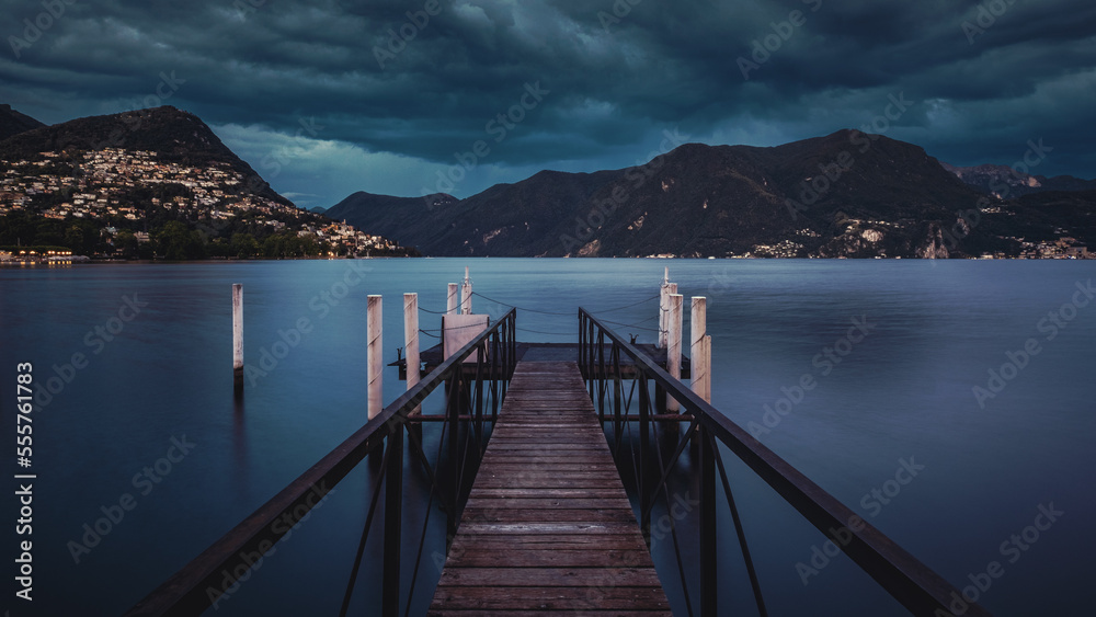 Lugano lake, pier and mountains