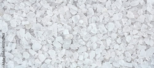 Large sea white salt as background, top view. Sea salt texture.