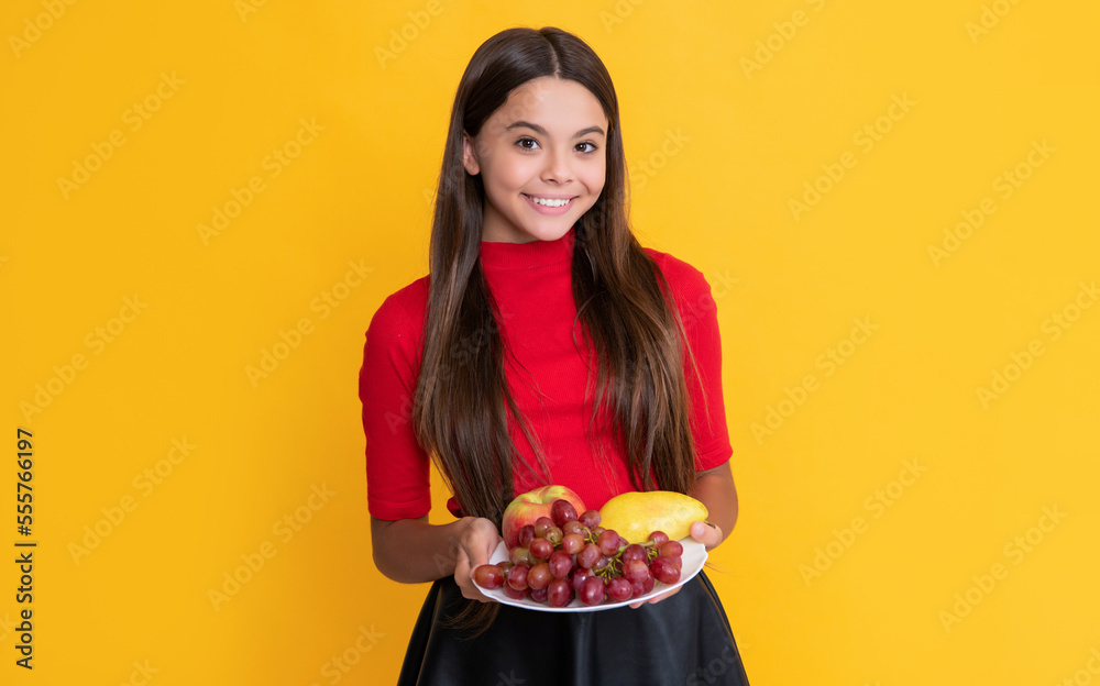 child smile hold fresh fruit plate on yellow background child smile hold fresh fruit plate on yellow background