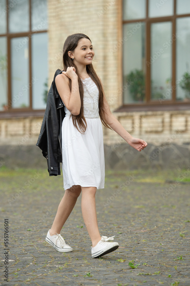 glad pretty teen girl. adorable girl fashion model. teenager girl walking outdoor glad pretty teen girl. adorable girl fashion model. teenager girl walking outdoor