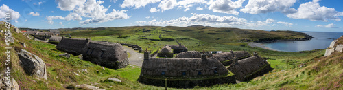 Gearrannan Blackhouse village houses with thatched roofs on the Isle of Lewis Scotland panoramic photo