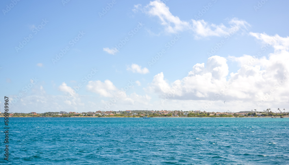 A beautiful coastal view on Aruba island from Caribbean sea. Space for text. A beautiful coastal view on Aruba island from Caribbean sea. Space for text.