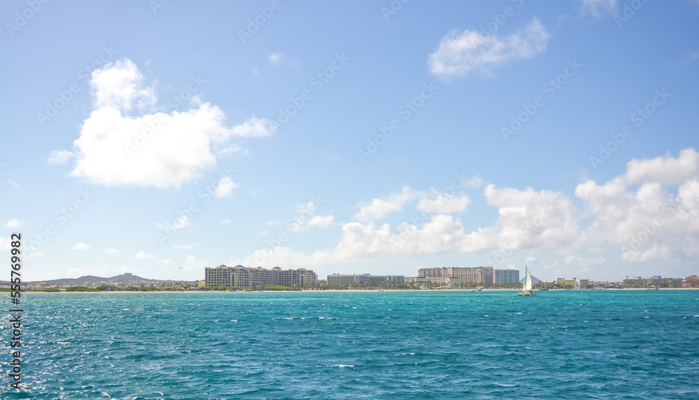 A beautiful coastal view on Aruba island from Caribbean sea. Space for text. A beautiful coastal view on Aruba island from Caribbean sea. Space for text.