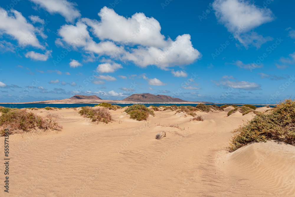 sand dunes and blue sky with clouds