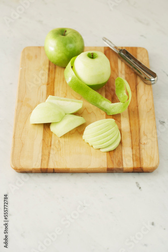 Peeled Apples on Cutting Board photo