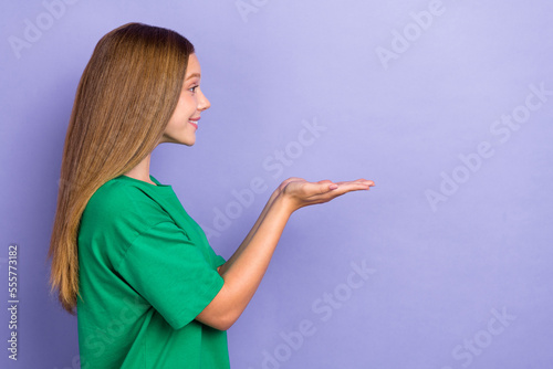 Close up profile side photo of cute pretty lady two arms demonstrate present empty blank space isolated on purple color background