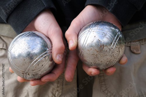 Boy's Hands Holding Petanque Balls