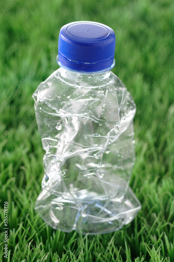 Crumpled Plastic Bottle in Grass