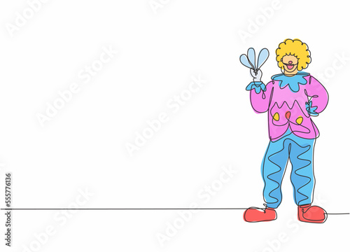 Single one line drawing of young male clown pose standing while holding juggler. Professional work profession and occupation minimal concept. Continuous line draw design graphic vector illustration