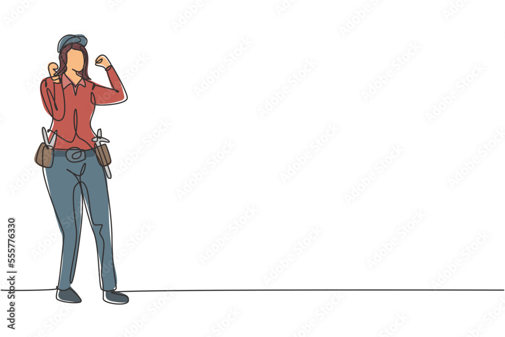 Single continuous line drawing handywoman stands with celebrate gesture and tools such as pliers, screwdriver, hammer that is placed on work shirt. One line draw graphic design vector illustration