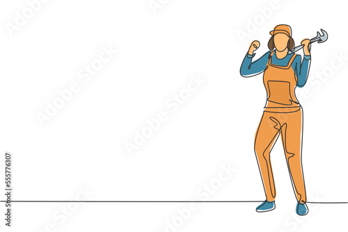 Single one line drawing female plumber stands with celebrate gesture and holding carpentry tool fixing broken plumbing at home. Successful job. Continuous line draw design graphic vector illustration