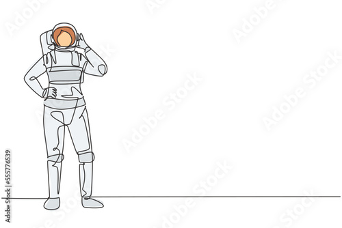 Single continuous line drawing female astronaut stands with call me gesture wearing spacesuit exploring earth, moon, other planets in universe. Dynamic one line draw graphic design vector illustration