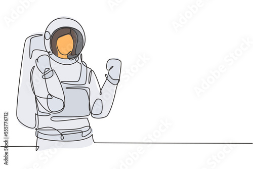 Continuous one line drawing female astronaut with celebrate gesture wearing spacesuits to explore outer space in search mysteries of universe. Single line draw design vector graphic illustration