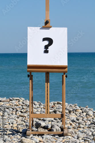 Easel with Question Mark on Canvas photo