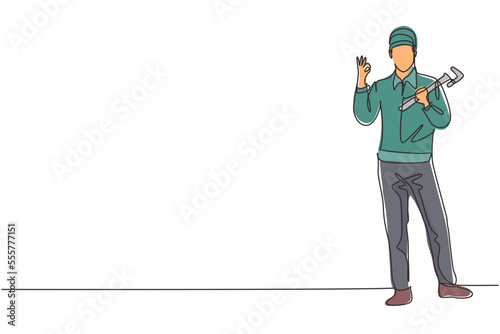 Continuous one line drawing plumber stands with gesture okay and holding carpentry tool fixing broken plumbing at home. Success business concept. Single line draw design vector graphic illustration