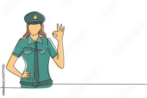 Single continuous line drawing female pilot with gesture okay and uniform ready to fly with cabin crew in aircraft at international airport. Dynamic one line draw graphic design vector illustration
