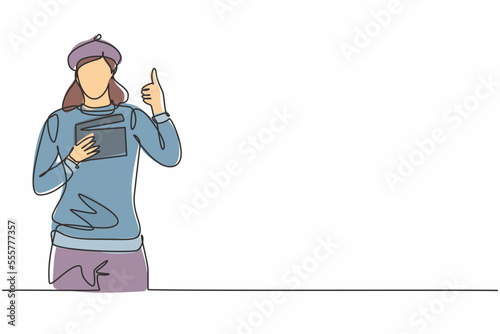 Continuous one line drawing female film director with a thumbs-up gesture while holding the clapperboard set the crew for studio shooting. Single line draw design vector graphic illustration